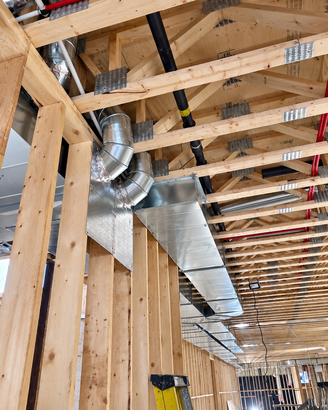 Duct trunk line and branch connections installed below floor trusses